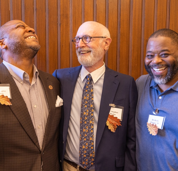 Three Peterson Society members laughing